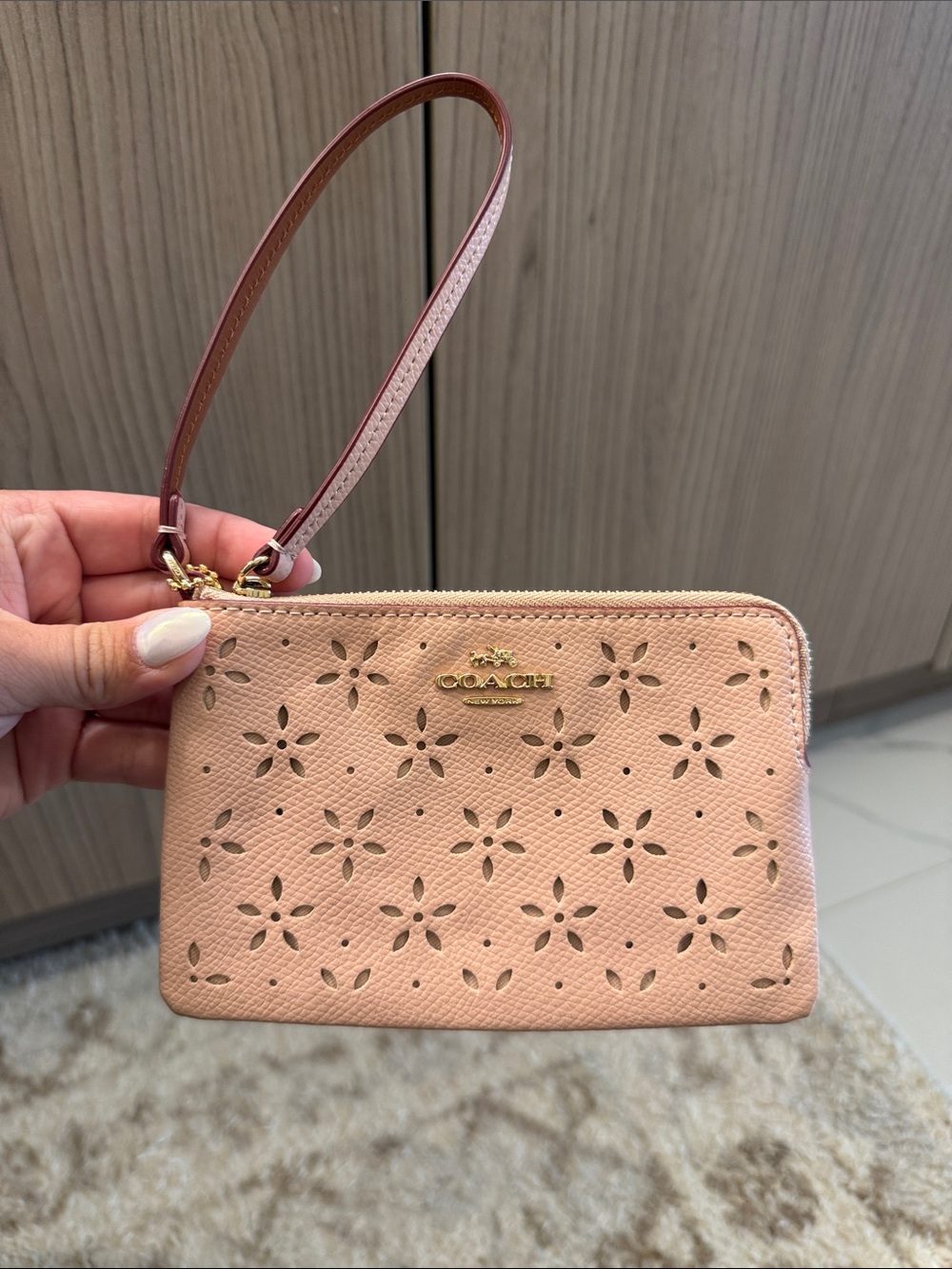 Coach Peach Floral Perforated Wristlet
